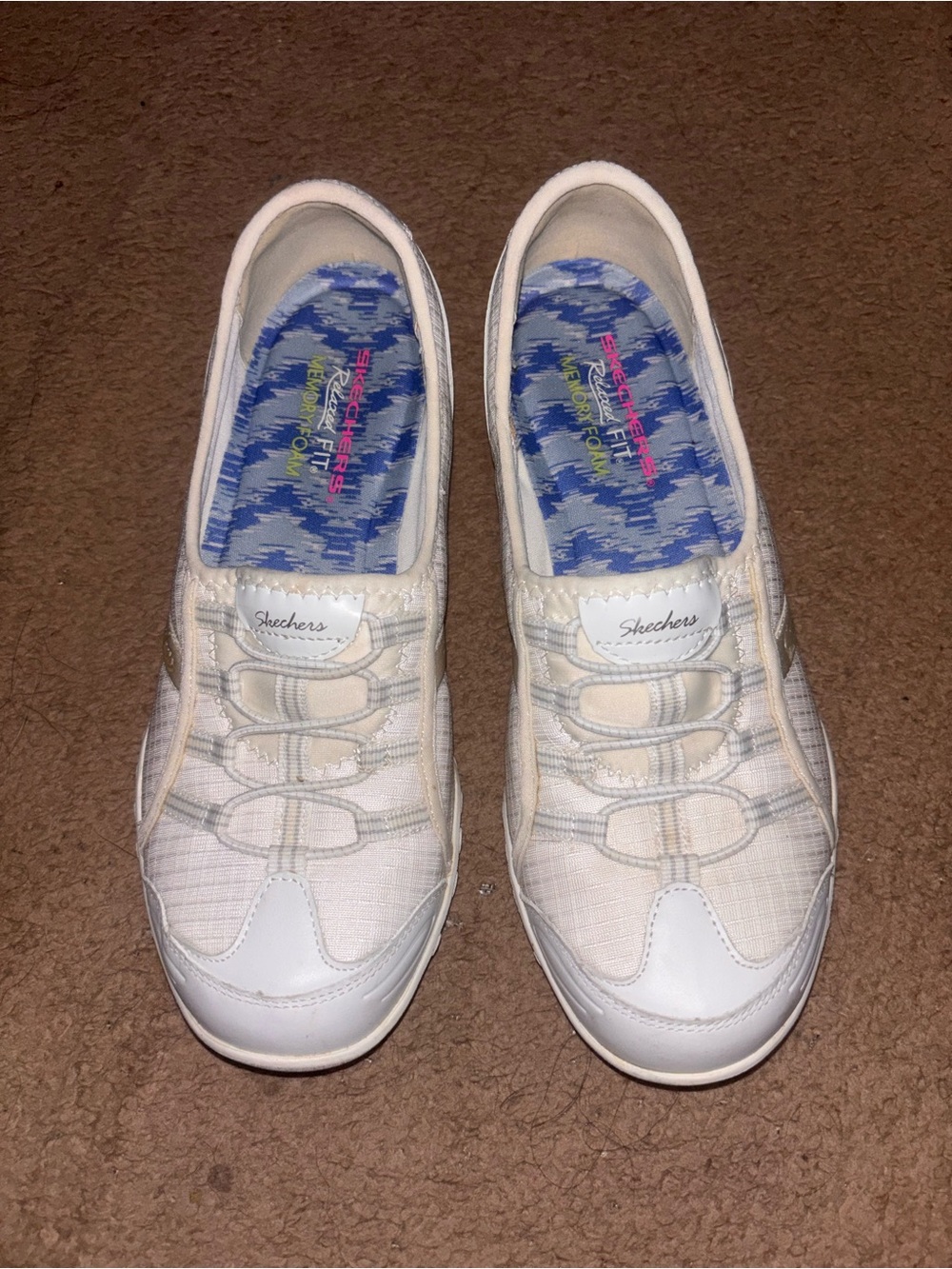 Skechers Women's White Slip-On Athletic Sneakers with Subtle Cream Accents